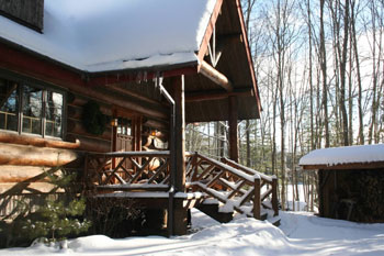 snow on front porch adk log rental home